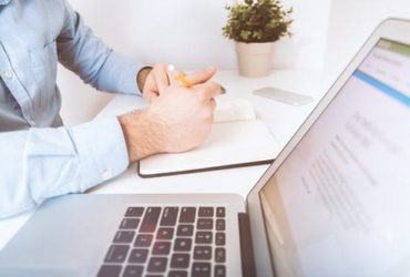 Man Working at desk - eBuilt Business